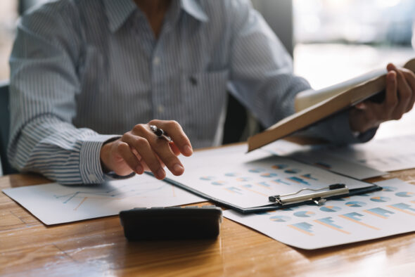 Businessman sitting planning analyze investment and marketing on